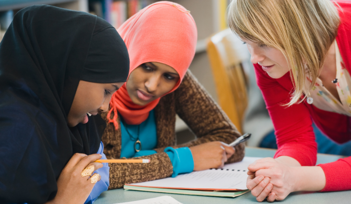 Three women discussing.